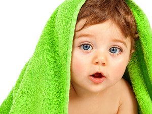 Photo of baby with green towel