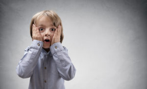 Young boy surprised