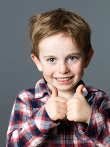 boy with thumbs up
