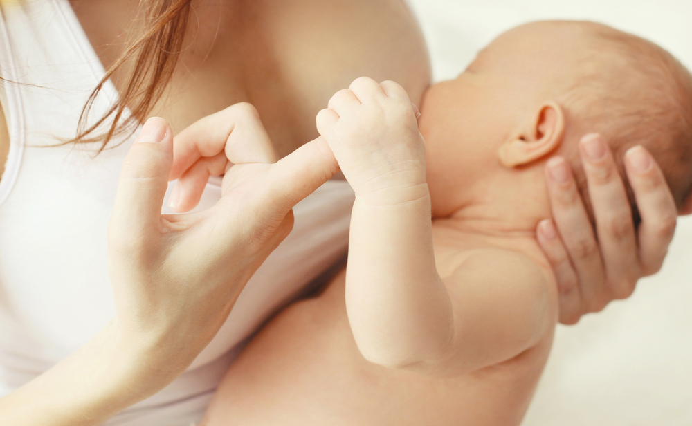Mother breastfeeding her infant