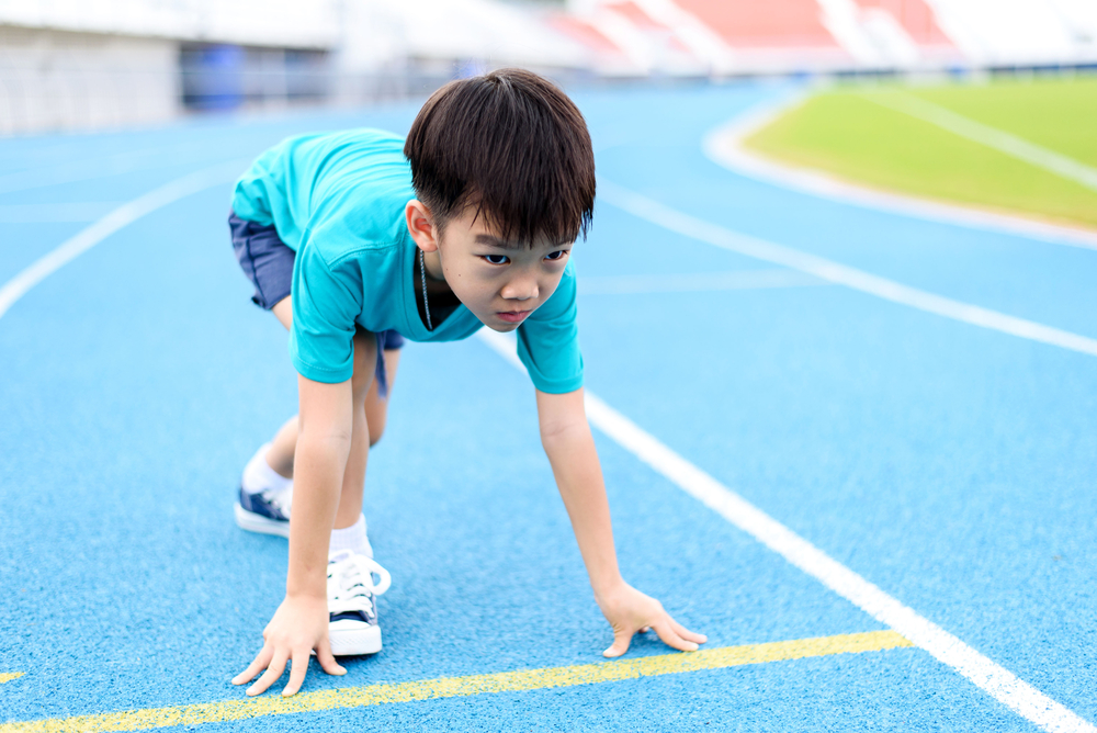 boy getting ready to run