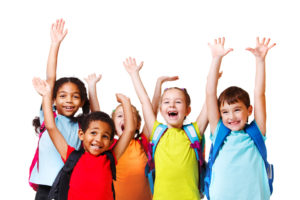Group of children wearing backpacks cheering happily