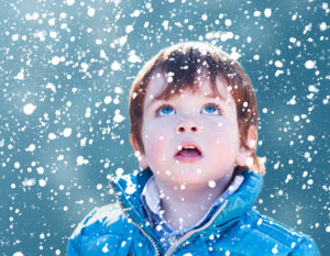 photo of boy with snowflakes