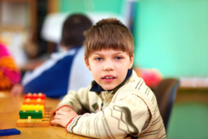 Young boy sitting in a classroom