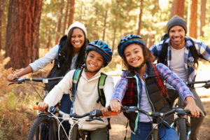 Photo of family mountain biking