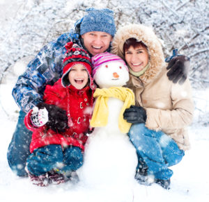 Photo of family with snowman