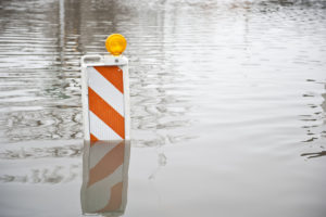 Flood waters covering up a sign