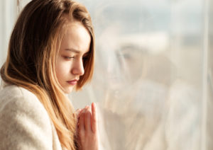 Girl looking out the window