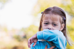 photo of girl coughing