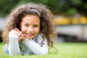 Girl smiling on the grass
