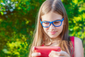 Younger girl playing a video game