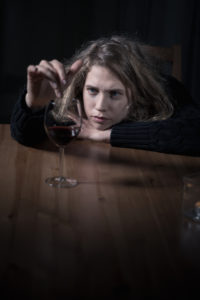 A girl with a wine glass