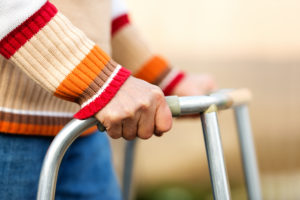 Photo of hands on walker
