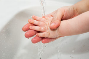 Child washing thier hand