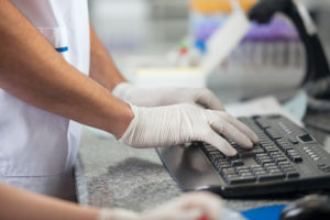 Lab in an office with woman typing on a keyboard