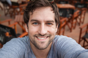 photo of man smiling indoors