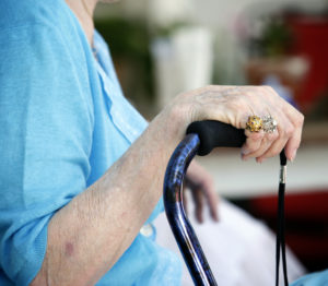 photo of hand with cane