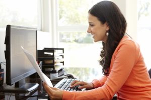 Photo of woman with computer