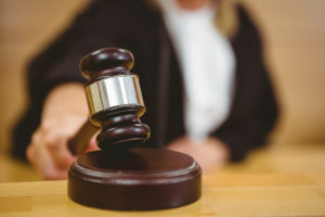 Court gavel on wooden table