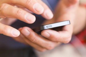 photo of hands and smartphone