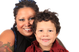 mom and boy smiling
