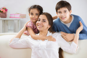 photo of mom with two kids