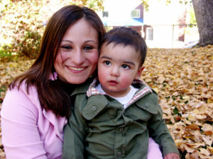 mom and boy with leaves