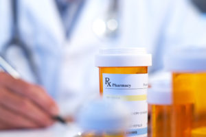 prescription bottle with medical background