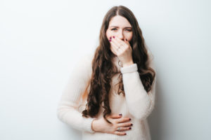 sick woman in sweater