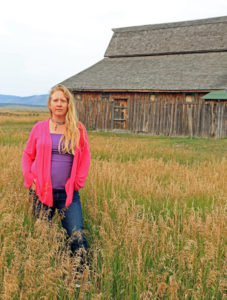 woman by barn