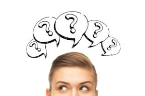 Photo of woman with question marks