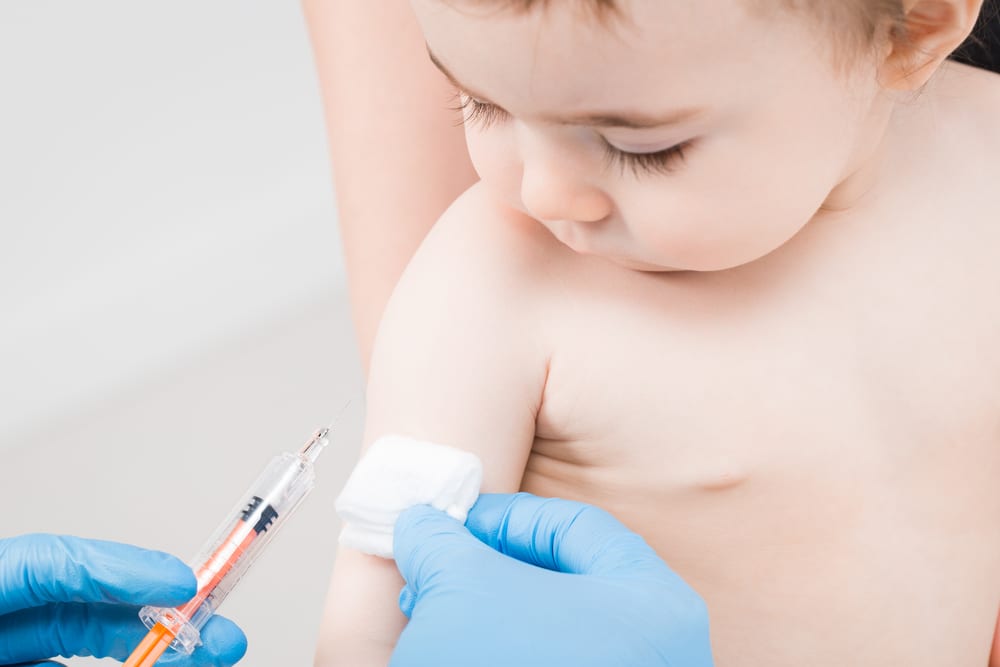 photo of baby with vaccine