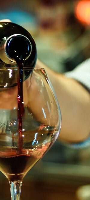 bottle pouring red wine