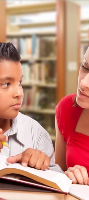 boy and woman at library