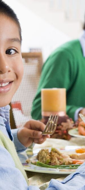boy at family dinner