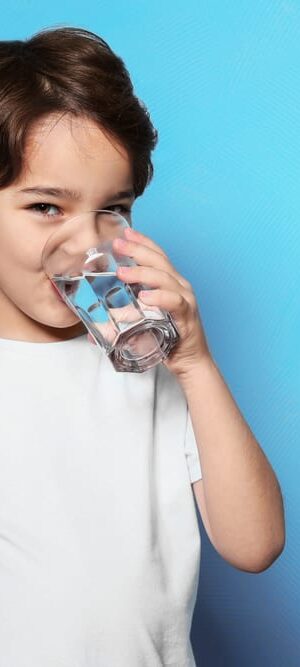 boy drinking glass of water