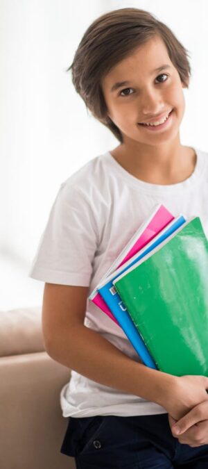 boy indoors with books