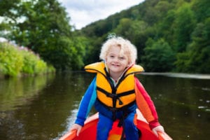 boy outdoors in kayak