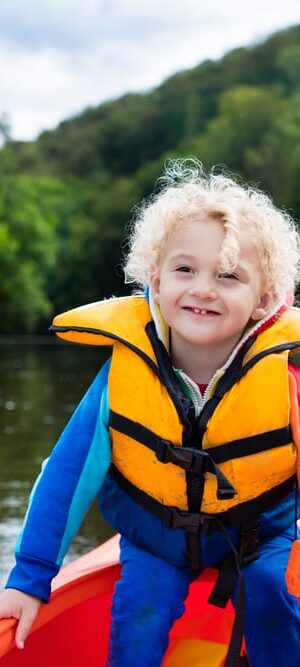 boy outdoors in kayak
