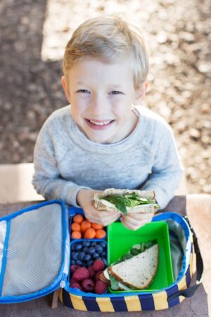 boy with lunchbox - Wyoming Department of Health