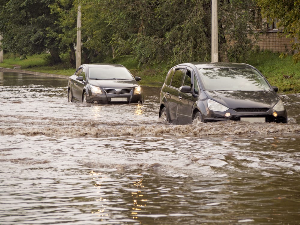 cars on flooded street - Wyoming Department of Health