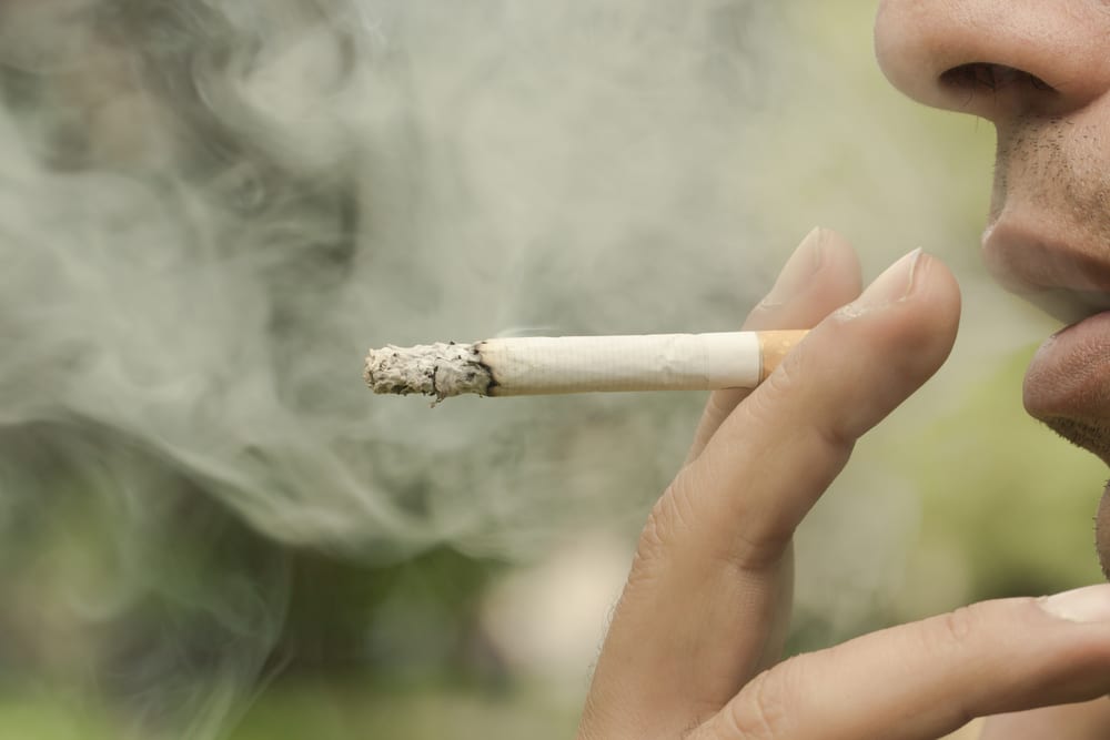 photo of cigarette and smoke