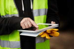 Photo of construction worker with tablet