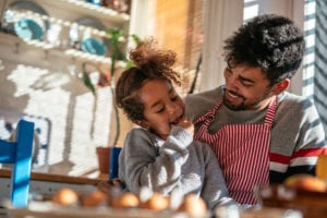 dad and girl cooking