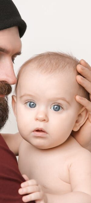 dad holding baby