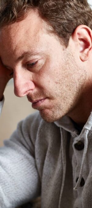 depressed man in sweater