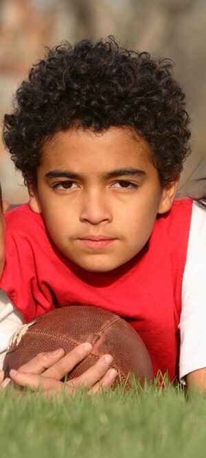 ethnic kids playing football