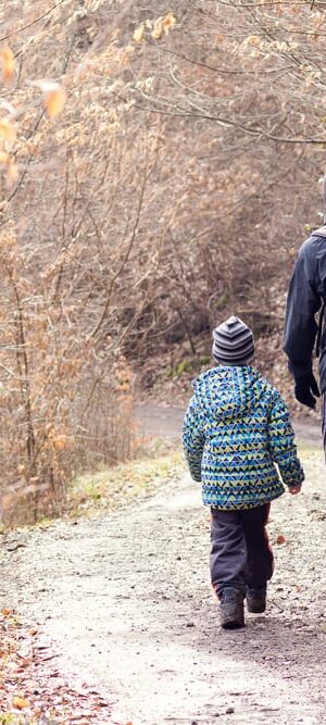 father and son on cold weather hike