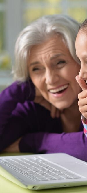 girl and grandma with computer