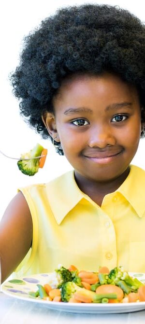 girl eating vegetables